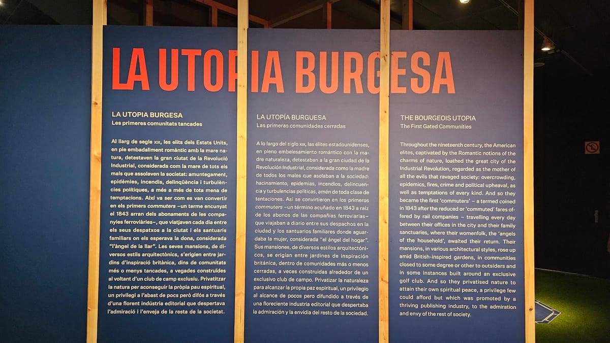 a blue panel with text and wood planks. the design alludes to blue prints and the frame of a house